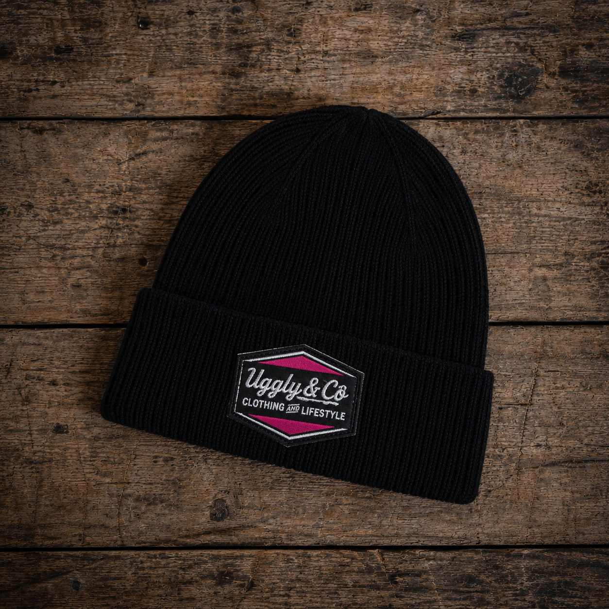 black and pink beanie with race inspired numbers, brad ray signature, diamond logo