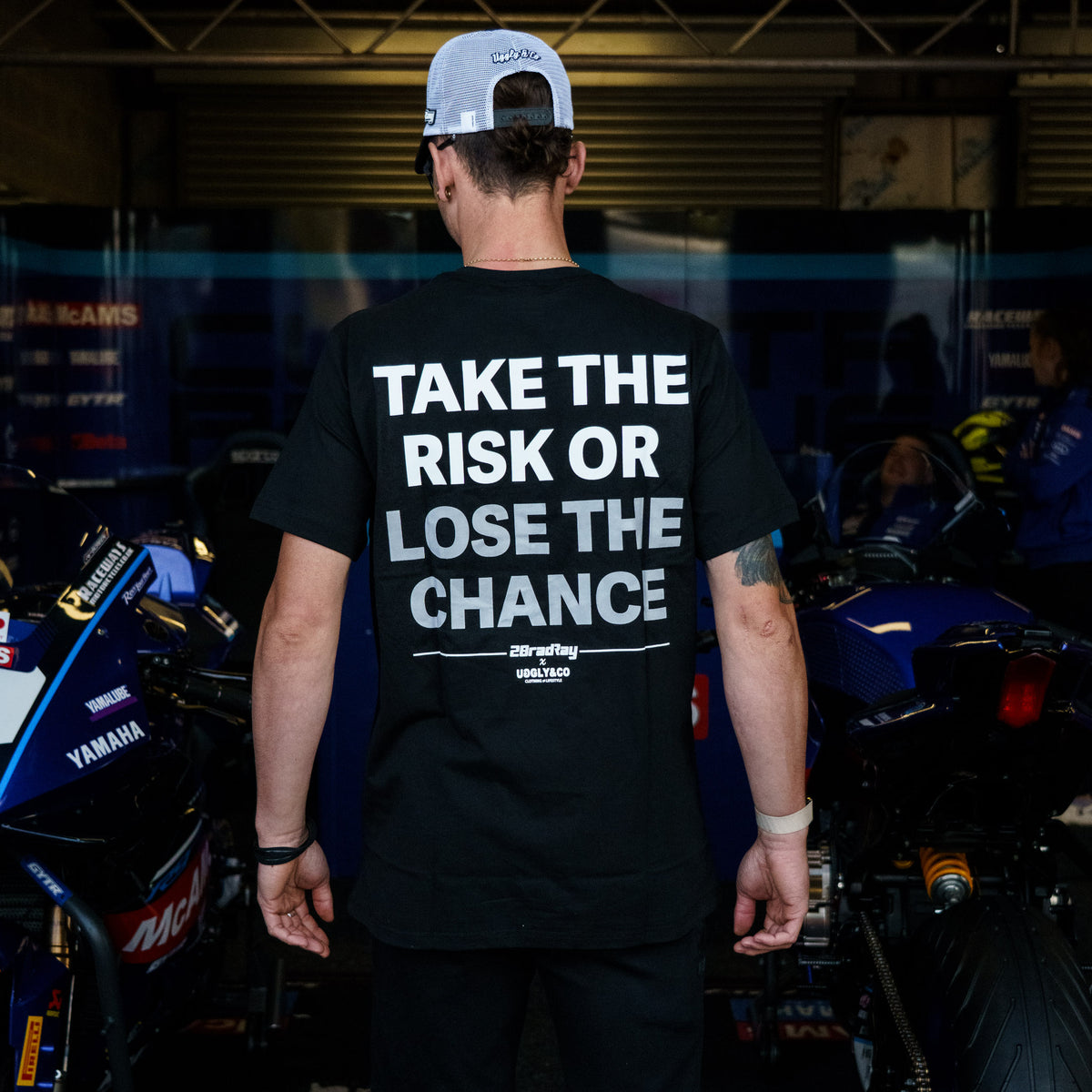 Black Bradley Ray T-Shirt photographed in a Yamaha British Superbikes garage