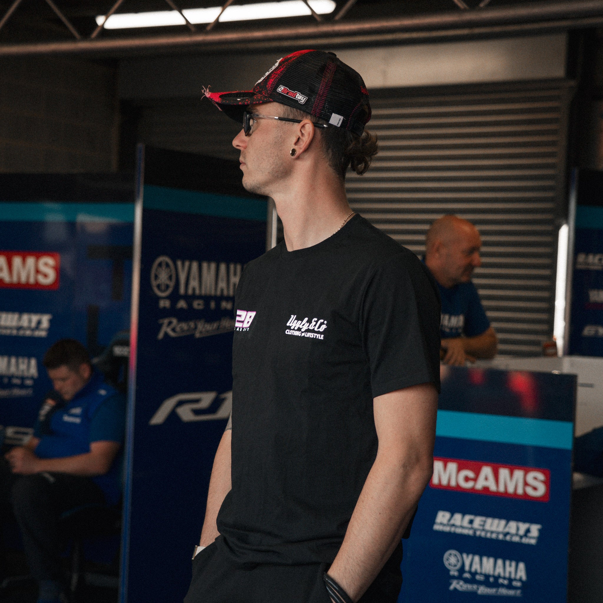 Bradley Ray #28 Black T-Shirt in a Yamaha racing garage setting