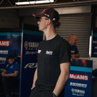 Bradley Ray #28 Black T-Shirt in a Yamaha racing garage setting