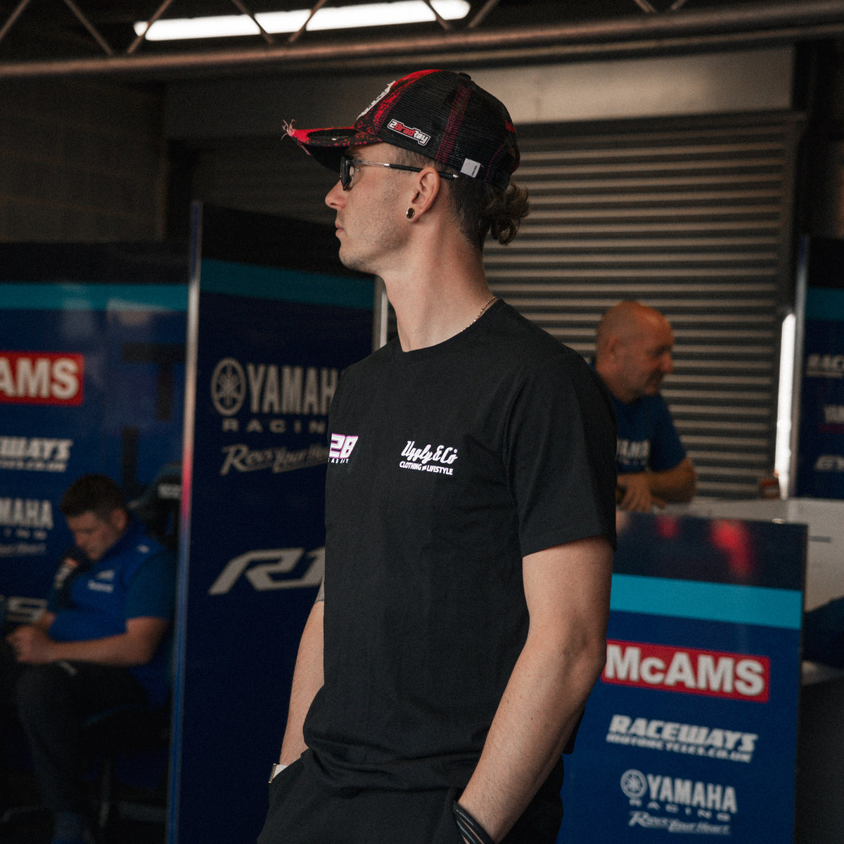 Bradley Ray #28 Black T-Shirt in a Yamaha racing garage setting