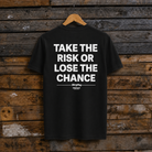 ack view of the black Bradley Ray tee with Take The Risk Or Lose The Chance print