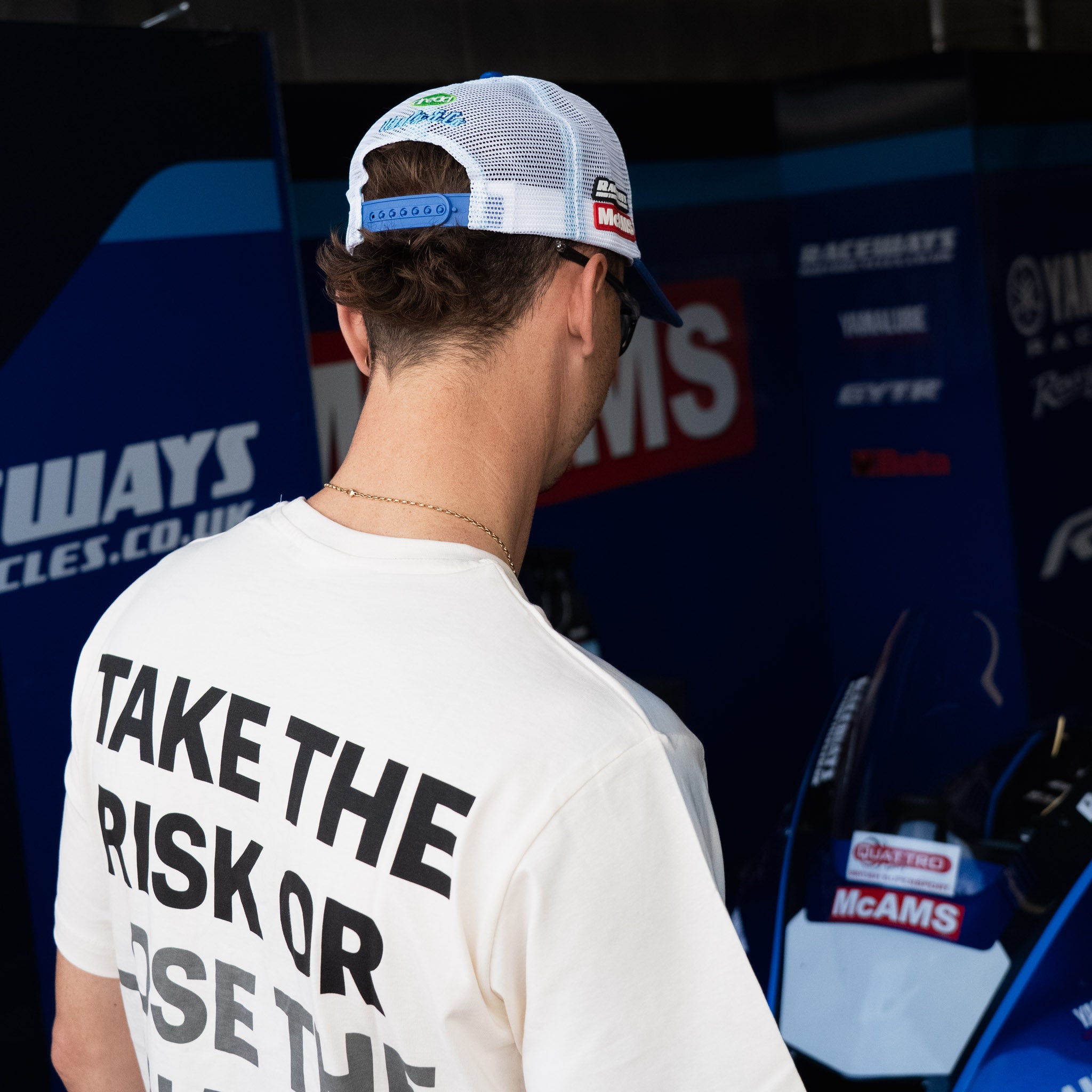 White Bradley Ray T-Shirt photographed in a Yamaha British Superbikes garage