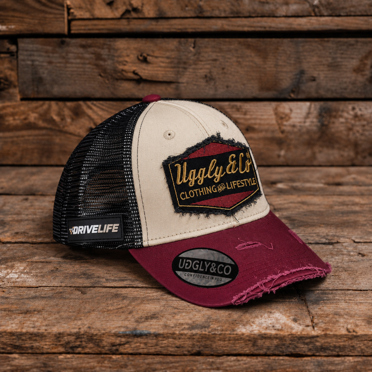 Burgundy, beige and gold Diamond trucker cap by Uggly & Co, front view with drive life badge