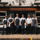 Butchers Tap restaurant staff wearing branded caps