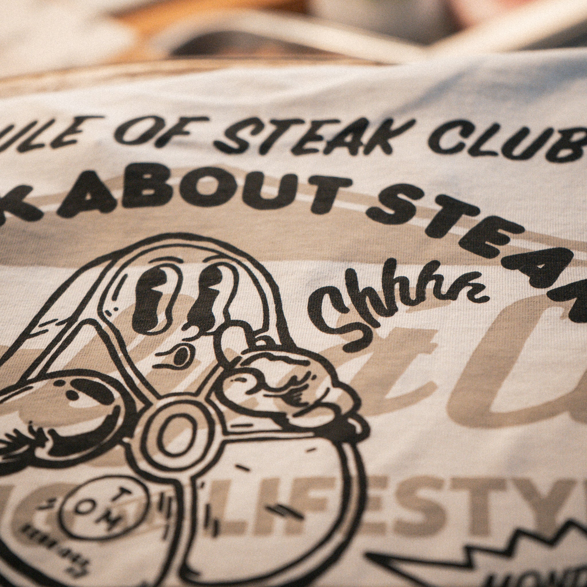 close up view of the Butchers Tap T-shirt showing the printed design