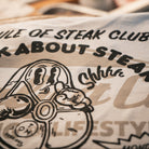 close up view of the Butchers Tap T-shirt showing the printed design