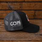 Side view of the Carl Cox Motorsport Cup Cap showing branded side detailing.
