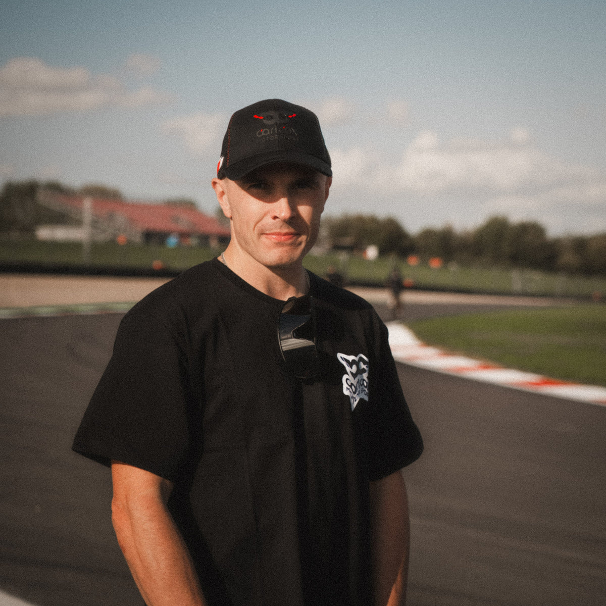 Motorcycle racer Simon Reid wearing the Carl Cox Motorsport Mono Street Drive T-Shirt by Uggly & Co at Donington Park during a British Superbike racing weekend.