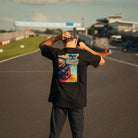 Carl Cox Motorsport Neon Street Drive T-Shirt photographed trackside at Donington Park, showcasing motorcycle racing inspired clothing from Uggly & Co.