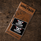 Carl Cox Motorsport sticker pack featuring two black rectangular stickers with white and red logo artwork in Uggly & Co packaging.
