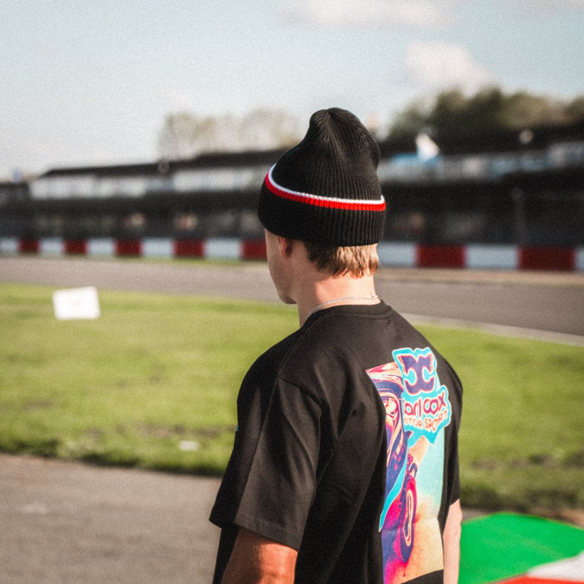 Rear view of the Carl Cox North West 200 Beanie by Uggly & Co, highlighting the knitted fabric and classic motorcycle lifestyle headwear design.