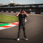 Model wearing the Carl Cox North West 200 Beanie by Uggly & Co, combining motorcycle road racing culture with casual motorsport streetwear.