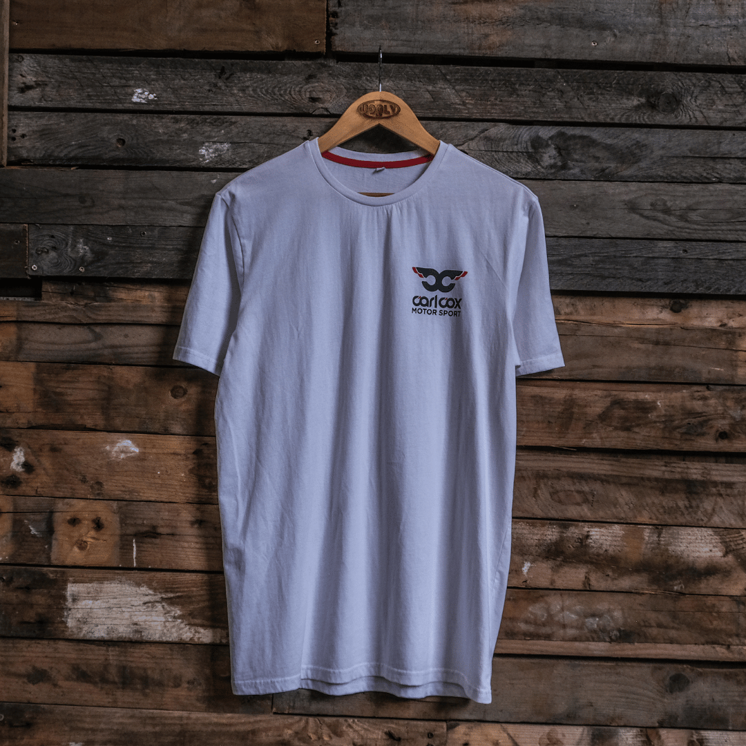 Front view of a Carl Cox Motorsport drag racing santa pod graphic white t-shirt on a wooden background