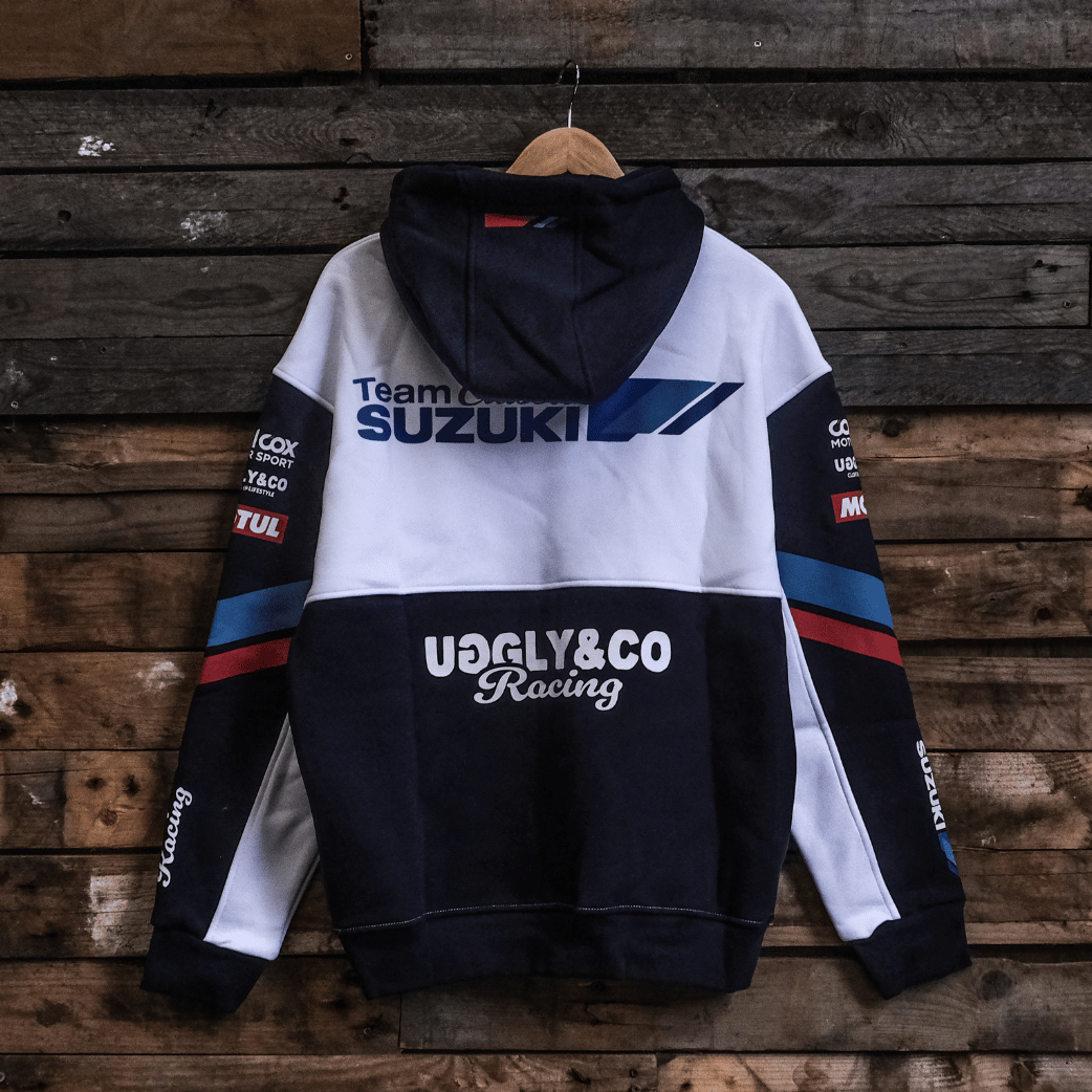Hoodie with Suzuki and Uggly&Co Racing logos on a wooden background