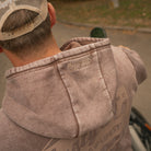 Close up of the Acid Wash Hoodie fabric and branding on hood