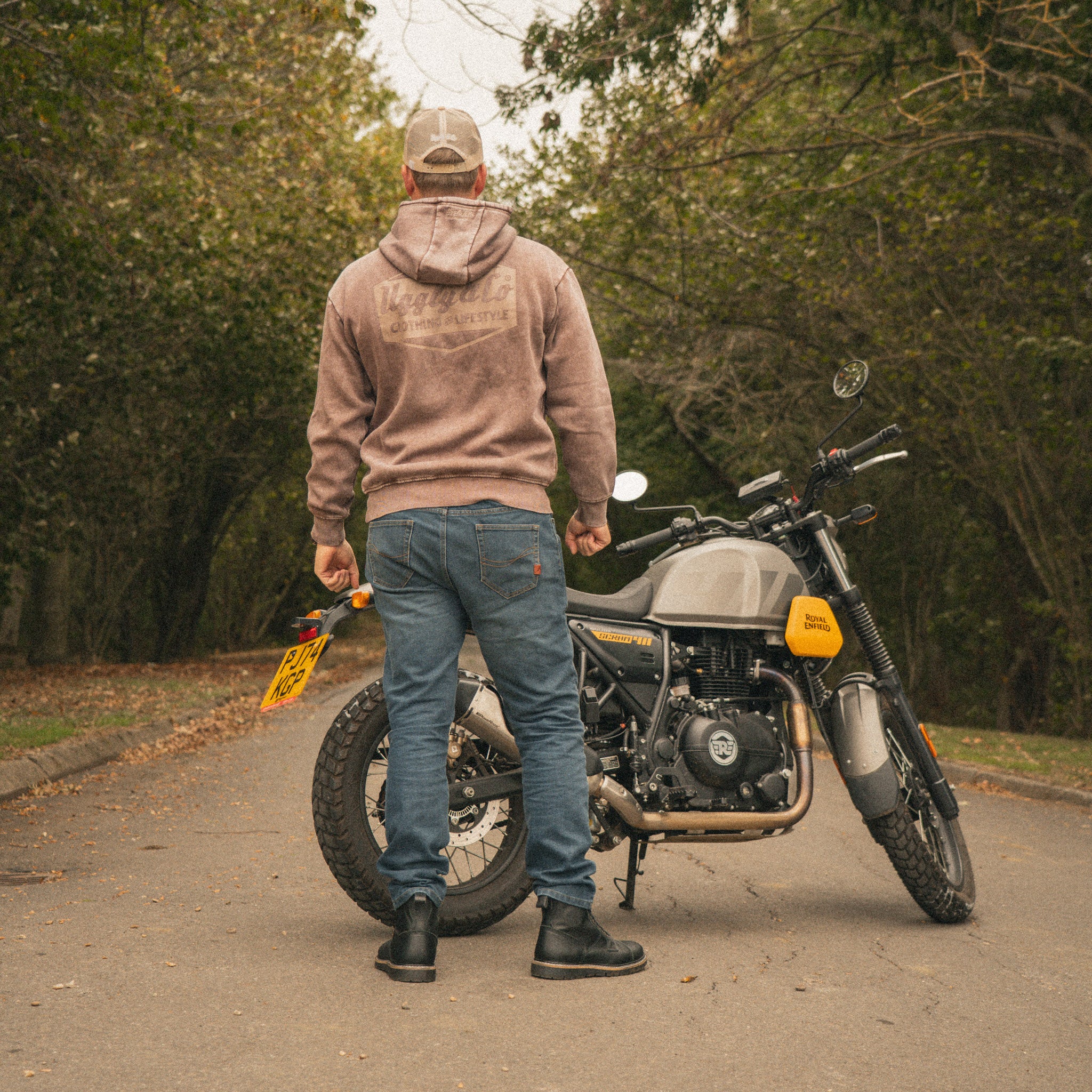 scram 411 with model wearing acid wash hoodie