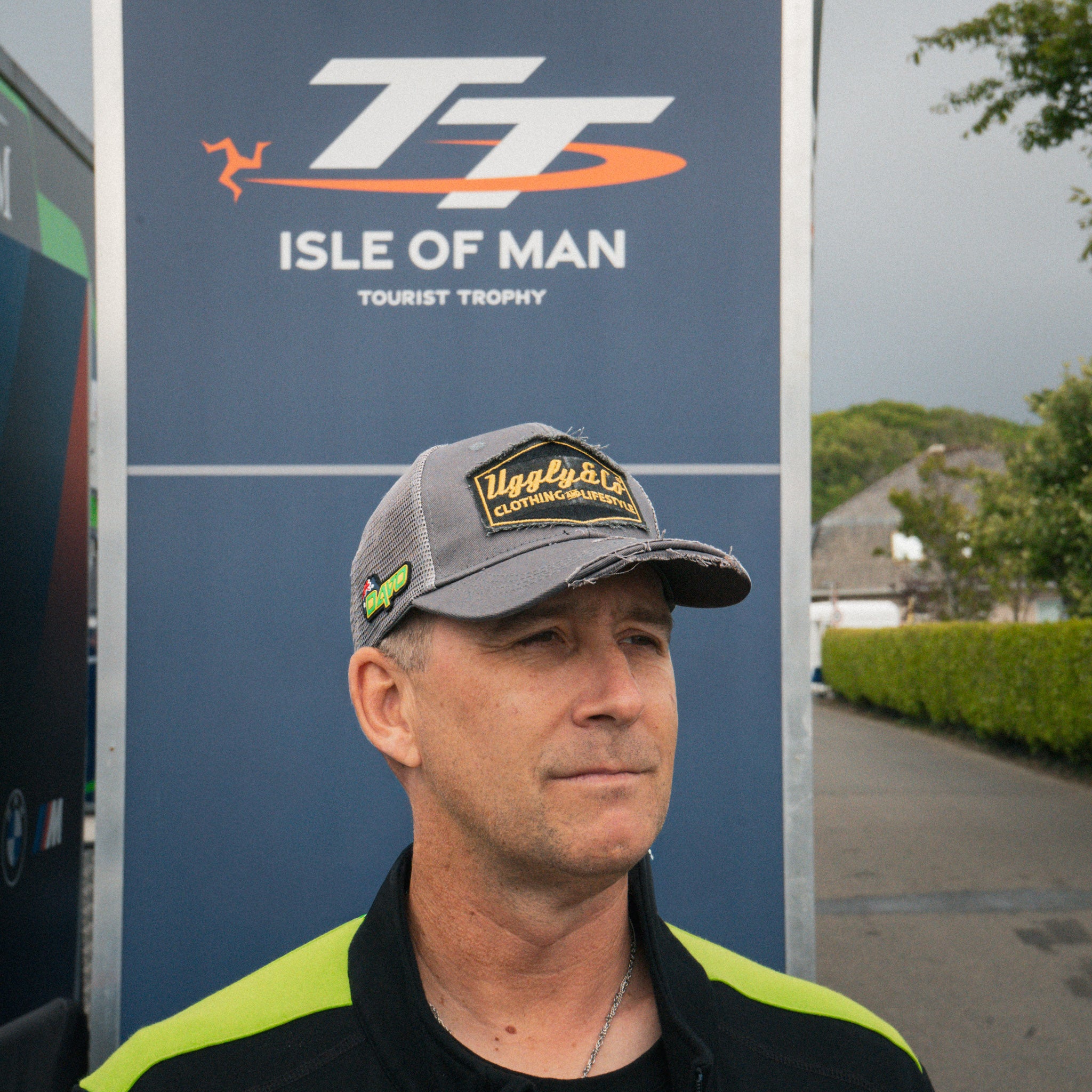 Davo Johnston wearing the Uggly&Co trucker hat in the race paddock
