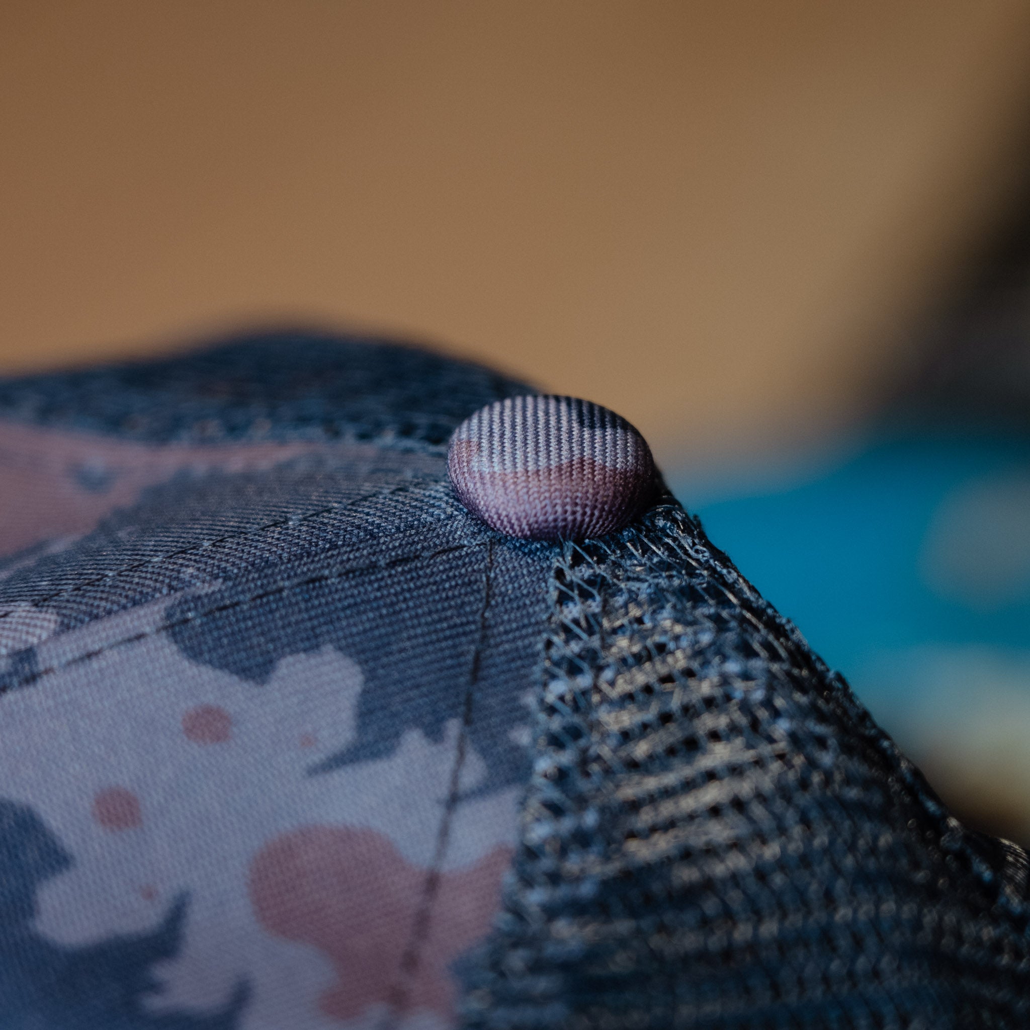 top detail shot of blue camo trucker hat