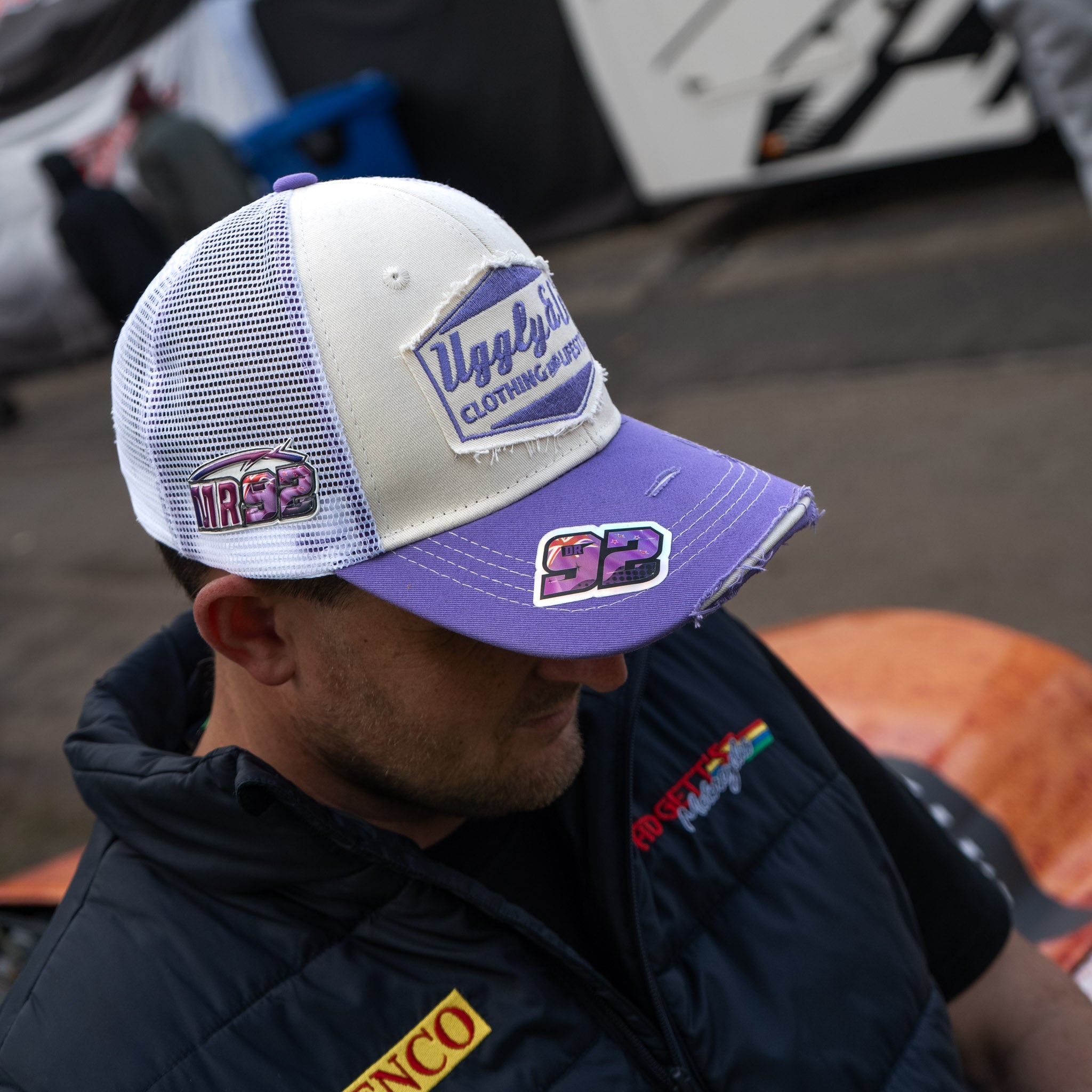 Mitch Rees wearing the Uggly&Co Diamond Trucker Hat at a motorcycle racing event