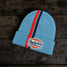 Front product photo of the Retro Diamond Light Blue & Orange Beanie on a wooden background