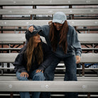 female models wearing vintage clothing in race grandstand