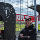 Trackside portrait of Fenton Seabright in a black and pink Diamond cap during a sunny race weekend