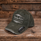 product photo showing green baseball cap with uggly and co diamond logo on a wood background