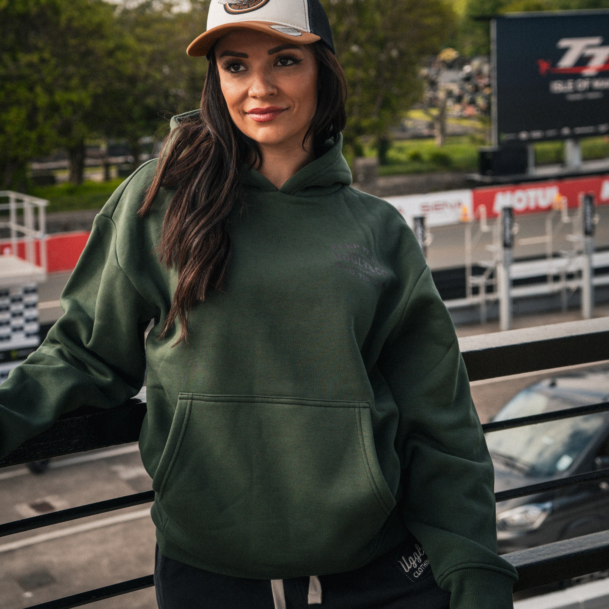 Female model wearing the green Keep It Lit hoodie from the front