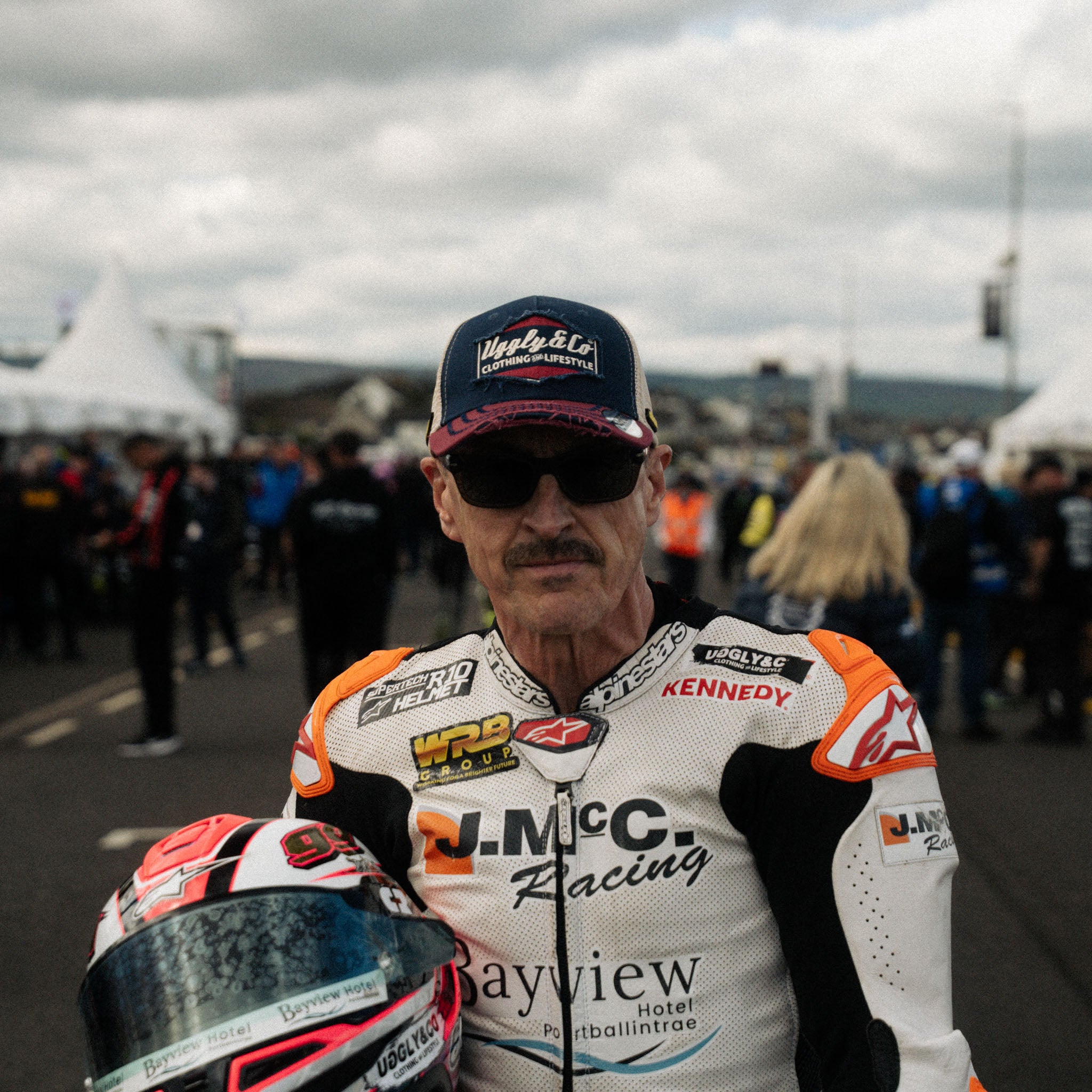 Jeremy McWilliams wearing Diamond trucker hat at motorcycle racing event portrait