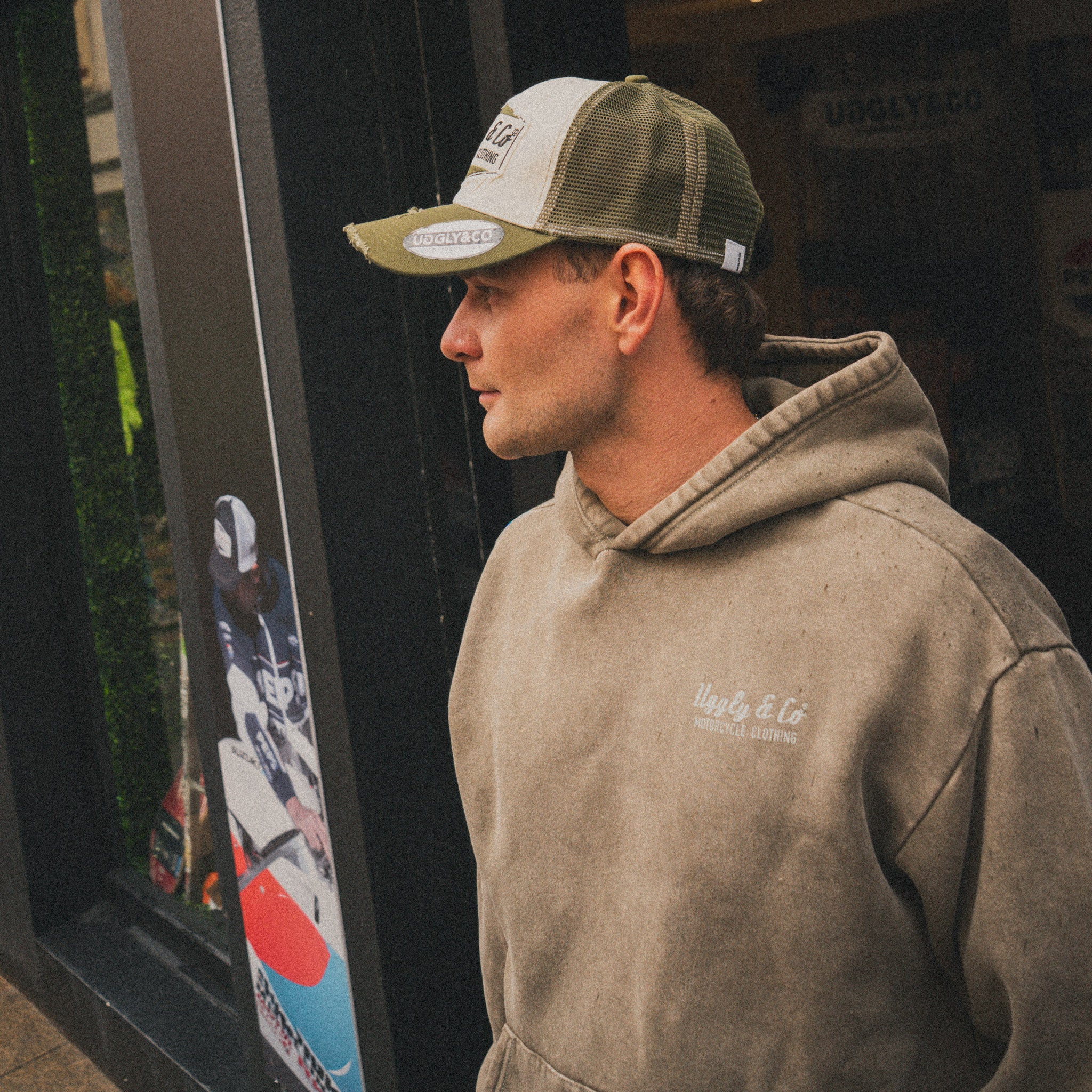 Joey Thompson wearing the green Diamond acid wash hoodie in a casual lifestyle setting.