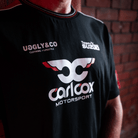 Close up of Josh Brookes wearing a Carl Cox motorsport and Team Classic Suzuki black and red t-shirt