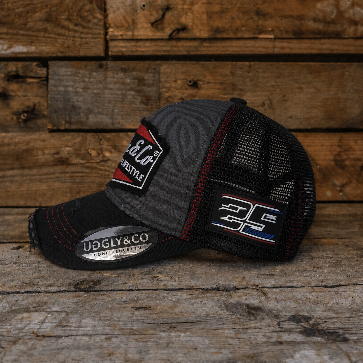 Side angle of the Josh Brooks x Diamond Zebra Cap showing the mesh back, curved peak and motorsport-inspired design.