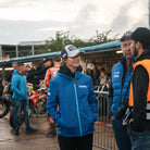 Katie Hand wearing the Off White and Navy Diamond Cap in the race paddock