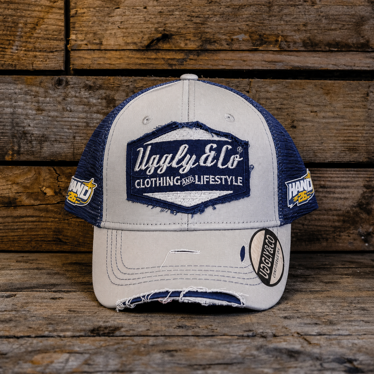 front view product photo of the Katie Hand signature Off White and Navy Diamond Trucker Hat
