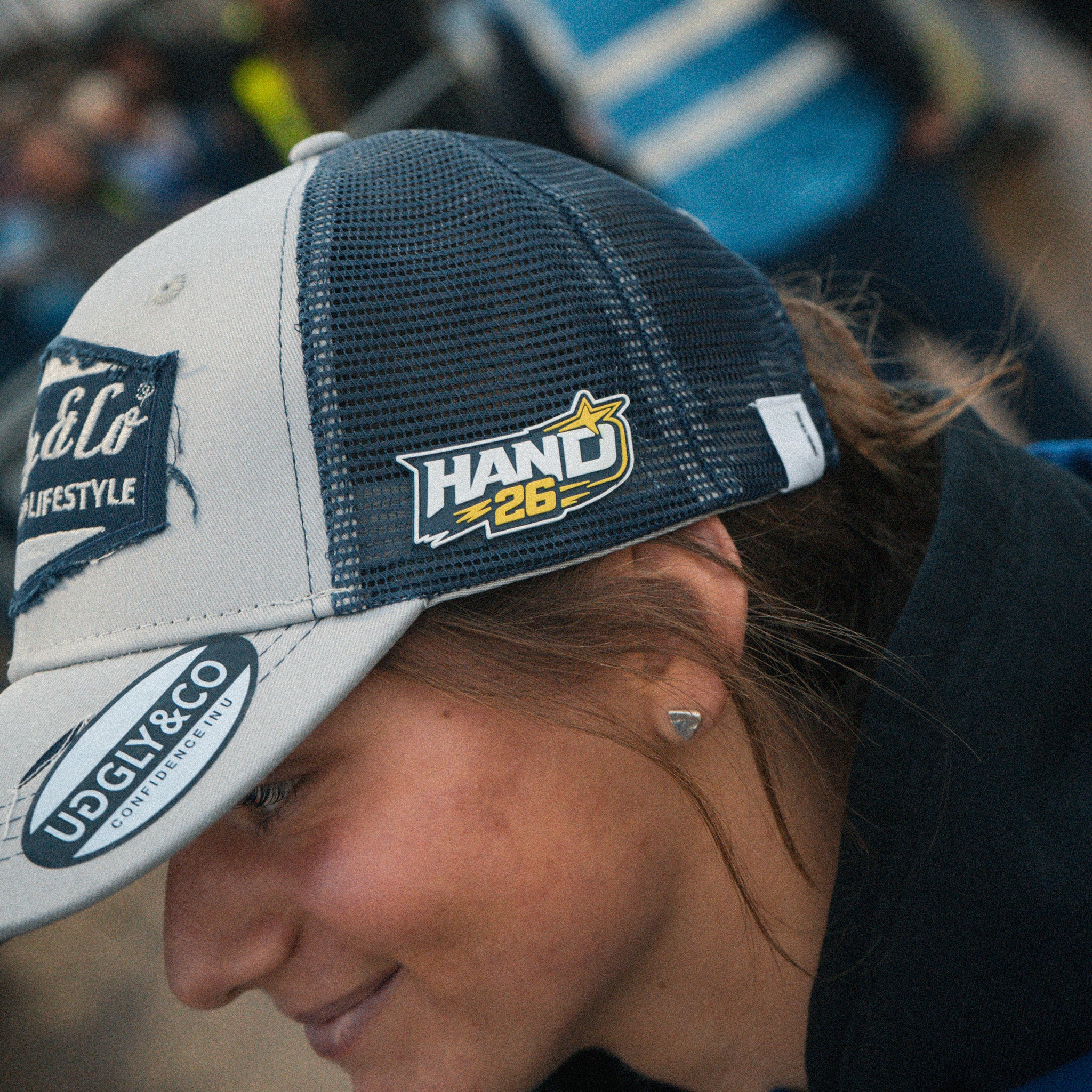 Motorcycle rider Katie Hand wearing her signature Uggly&Co Diamond Trucker Hat