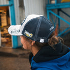 Katie Hand wearing her Uggly&Co Off White and Navy Diamond Trucker Hat
