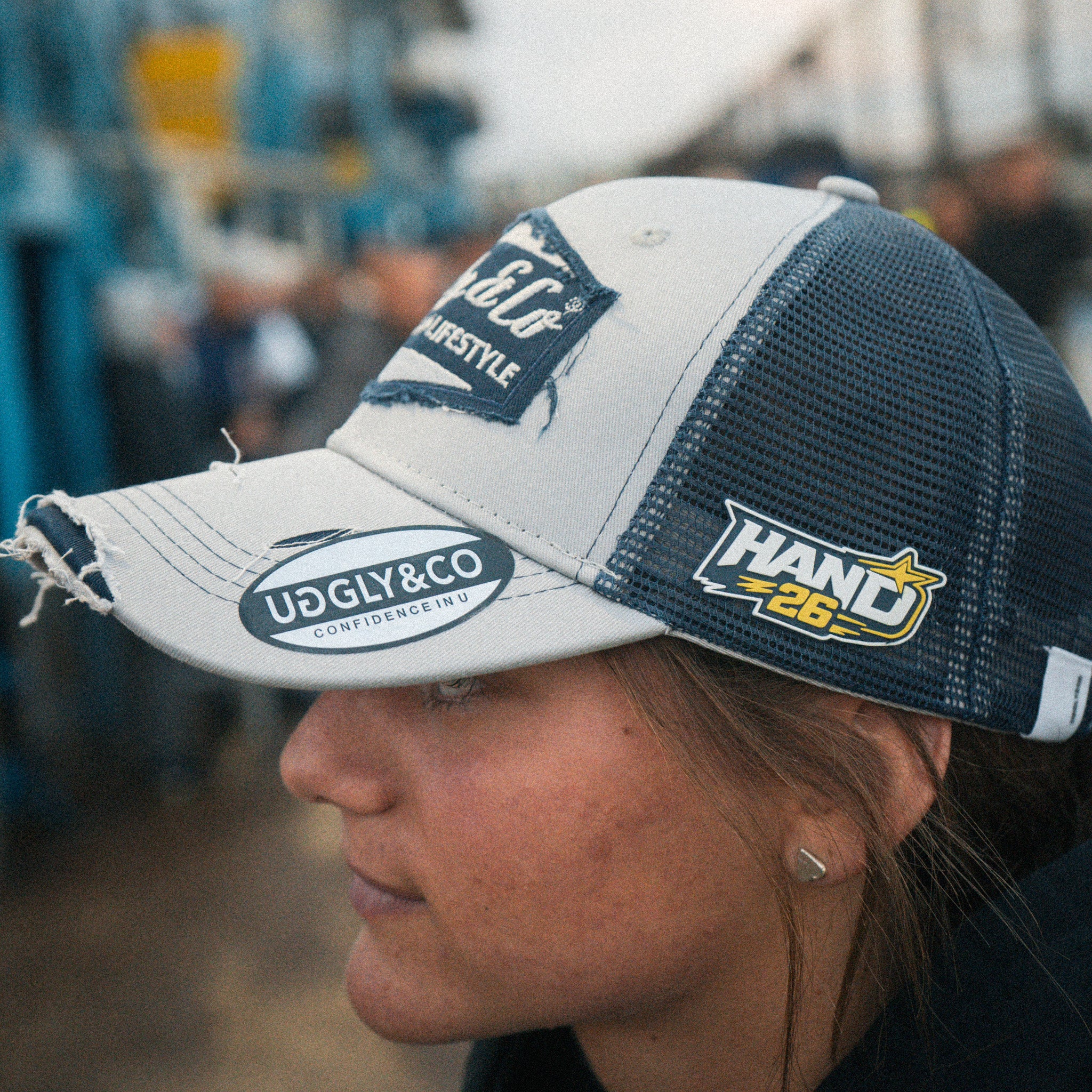Close-up of Katie Hand wearing the Uggly&Co Off White and Navy Diamond Cap