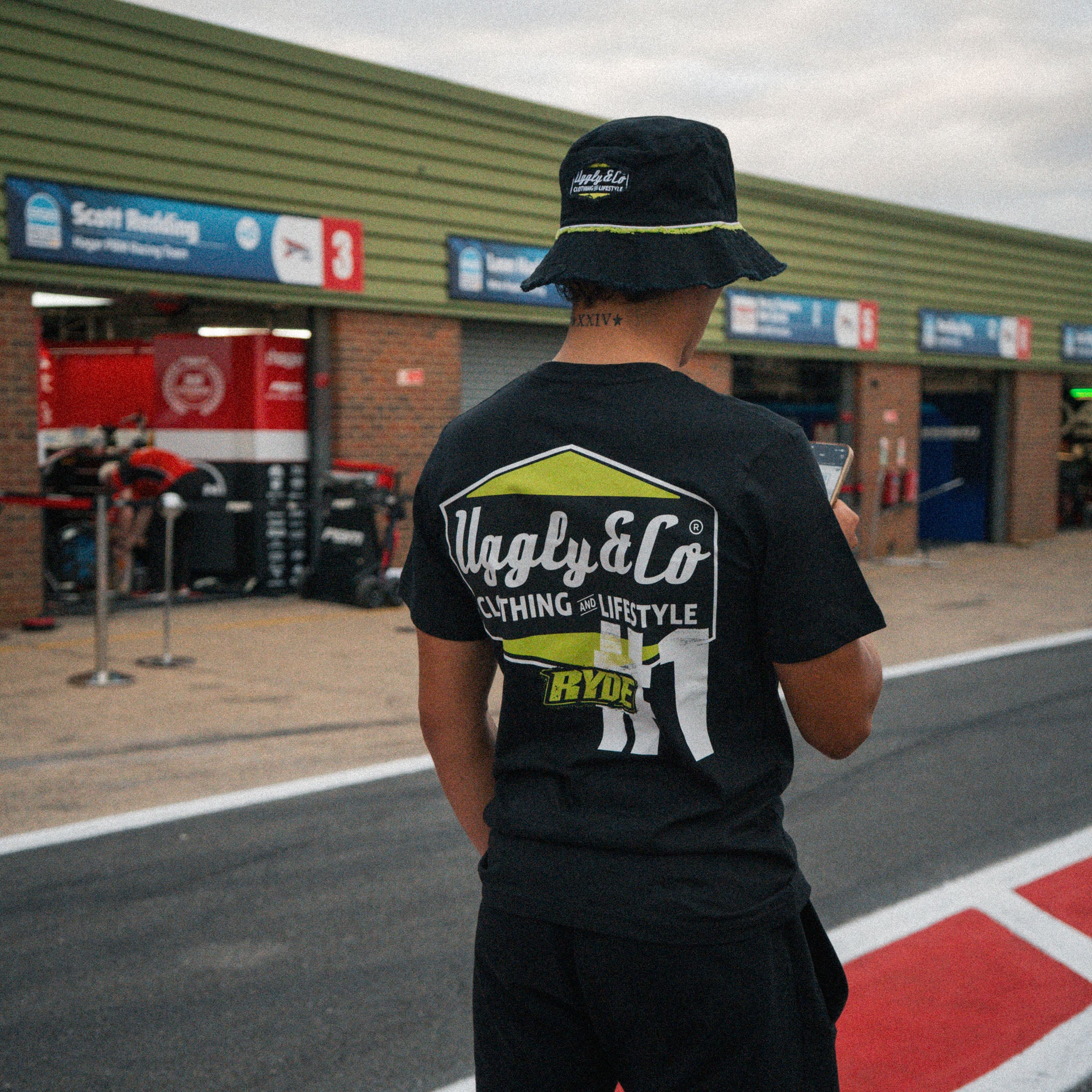 Pit lane photo of Kyle Ryde wearing the Uggly&Co Diamond T-Shirt before racing