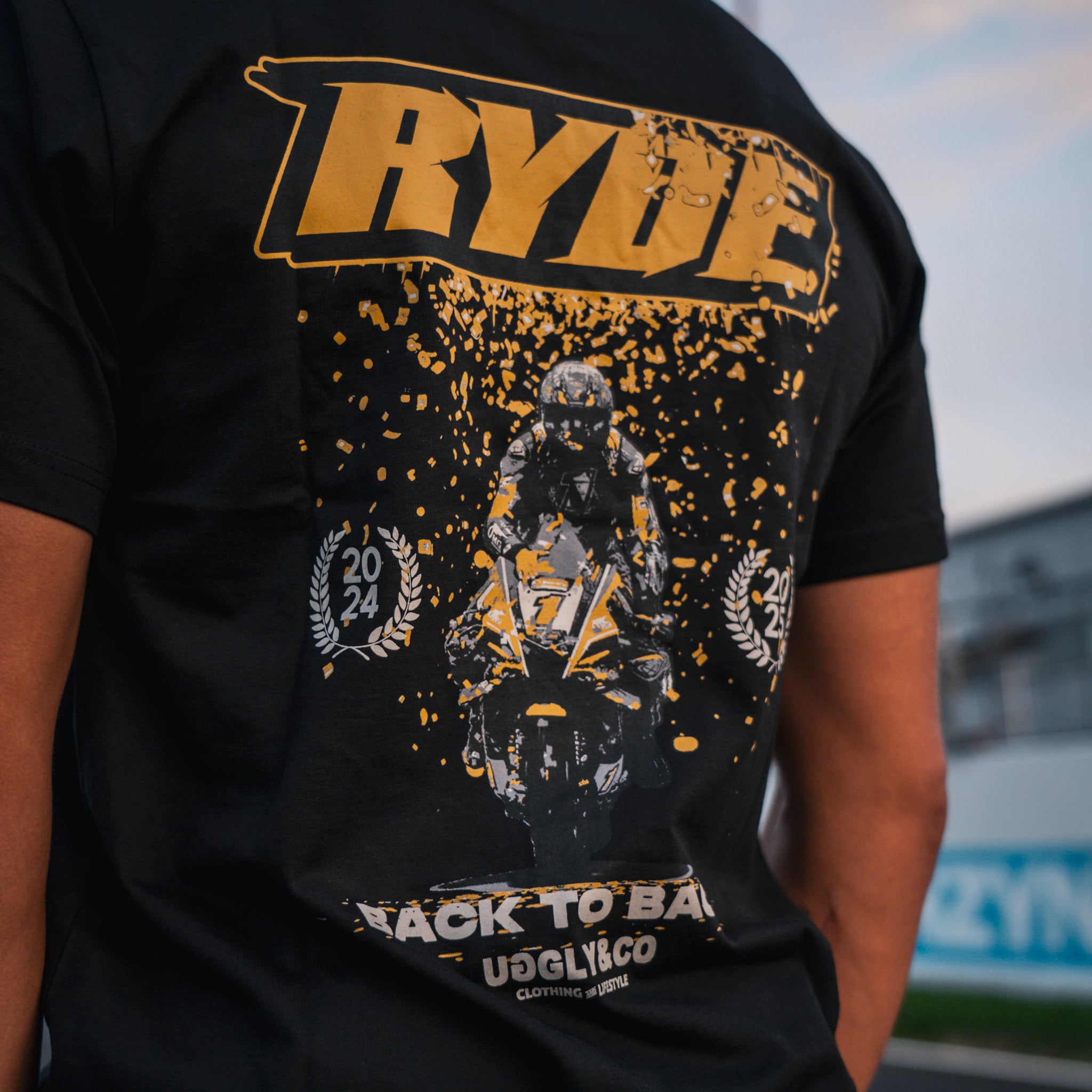 Championship graphic detail on Kyle Ryde Back-to-Back Confetti Tee
