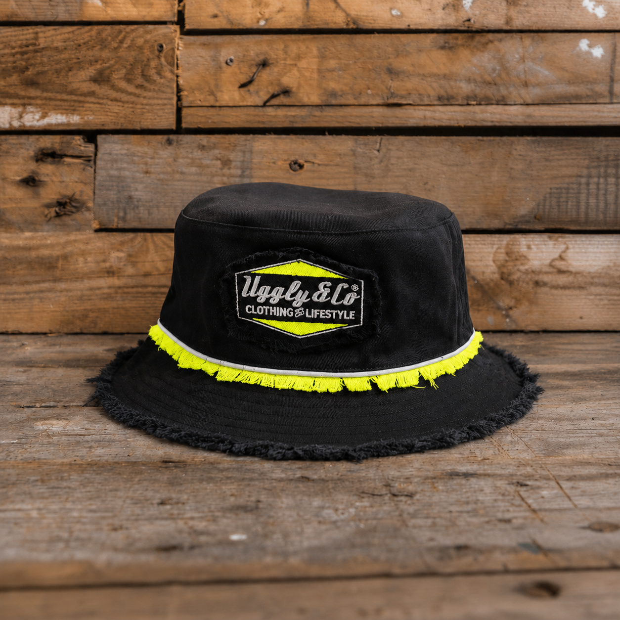 Kyle Ryde Diamond Bucket Hat product photo showing the Uggly&Co logo patch with neon yellow trim.