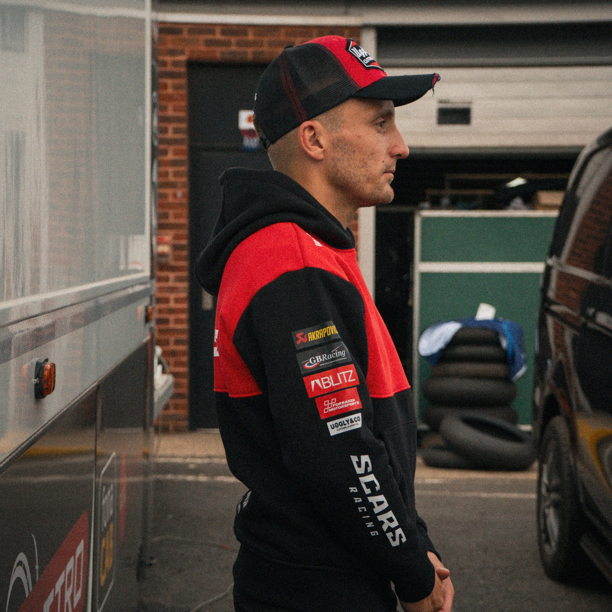 Luke Stapleford wearing the Scars Racing team hoodie at a motorsport event