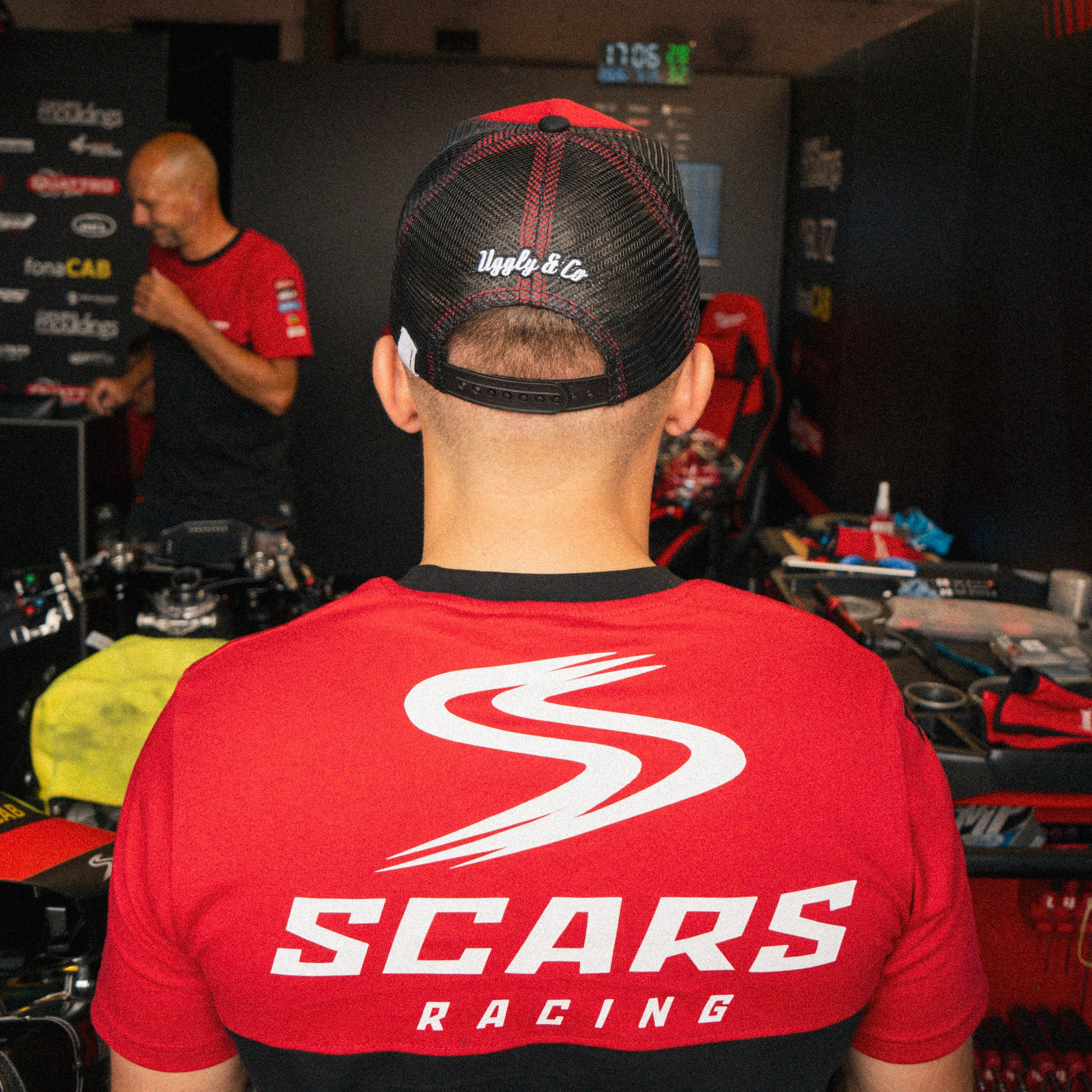 Luke Stapleford wearing a black Scars Racing T-shirt in the pit lane