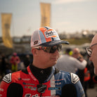 Marcus Simpson signature snapback hat with blue and orange colorway, retro hat seen in pit lane