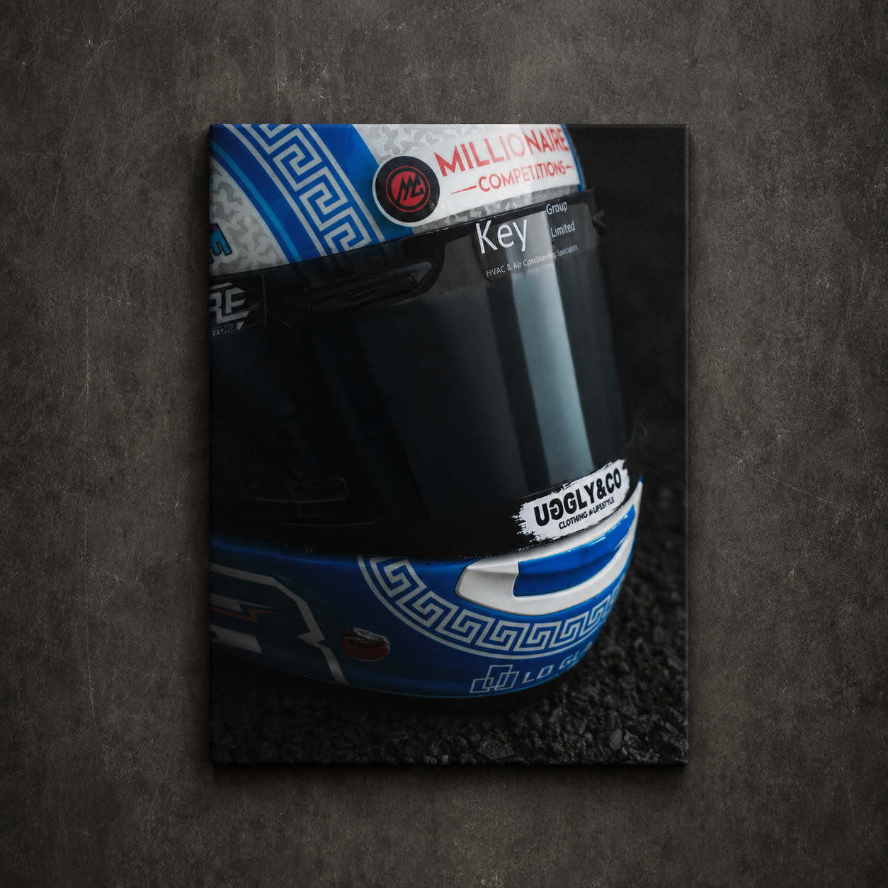 Close up of Marcus Simpson’s blue and white Uggly & Co racing helmet with dark visor, shown as canvas wall art.
