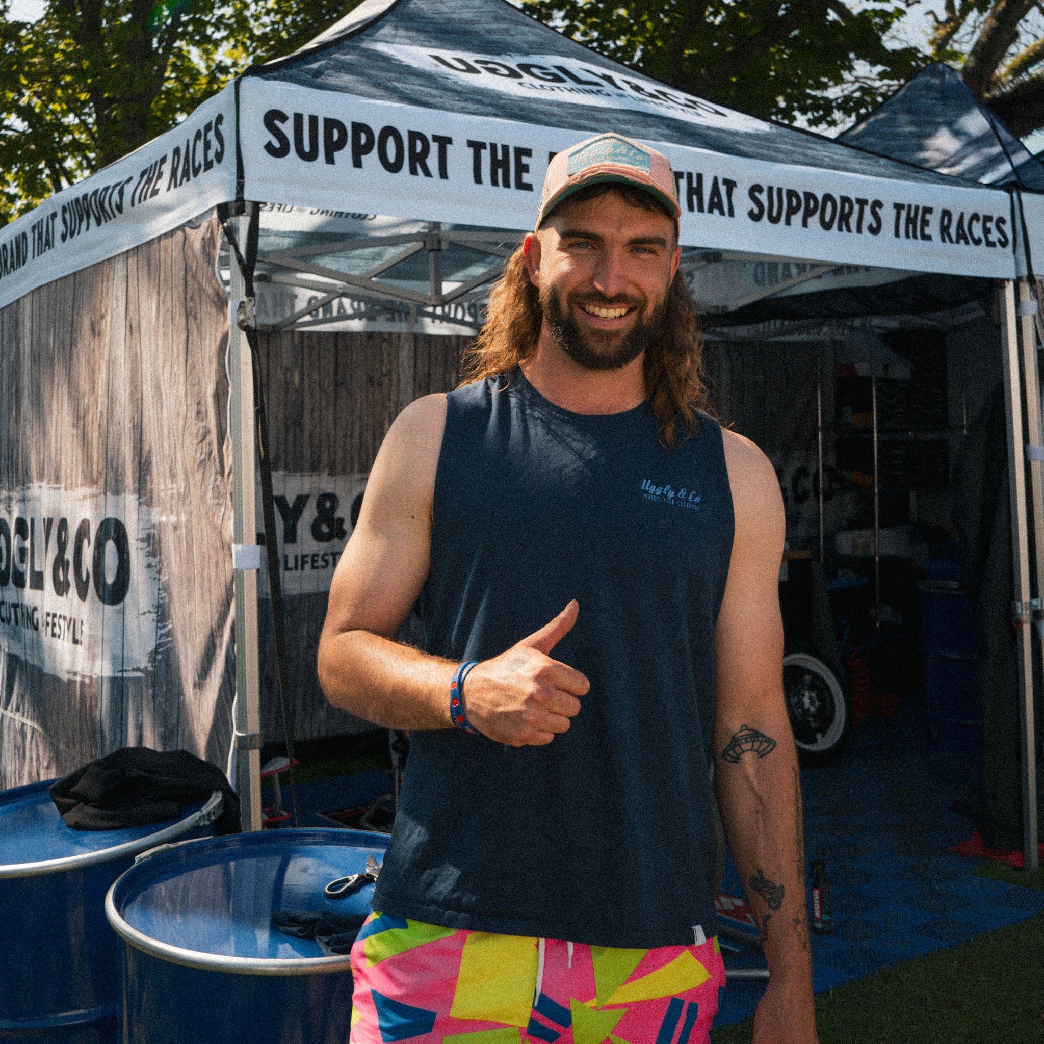 Matt Stevenson wearing a pastel pink and blue cap