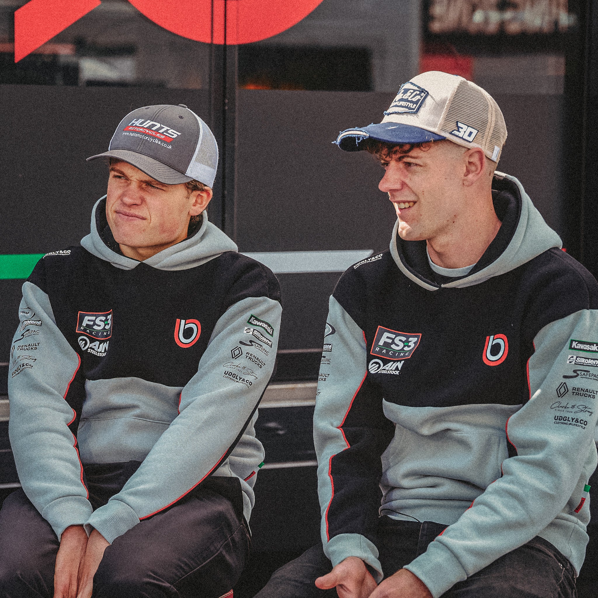 Max Cook and Joe Talbot in the black and grey Bimota Racing team hoodie with FS3 Racing branding