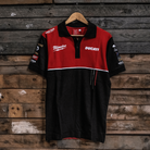 Red and black shirt with Ducati and Milwaukee logos on a wooden background