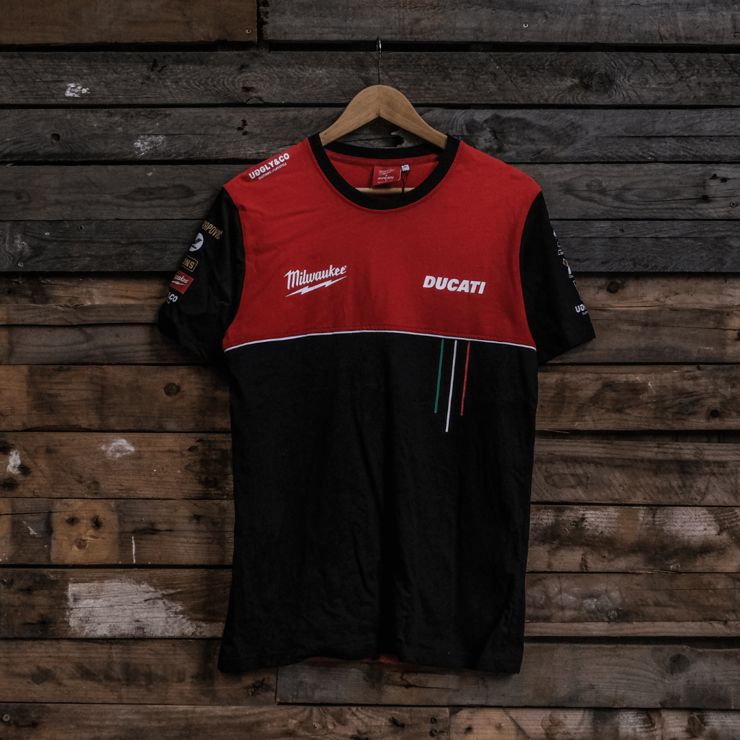 Black and red shirt with Ducati and Milwaukee logos on a wooden background
