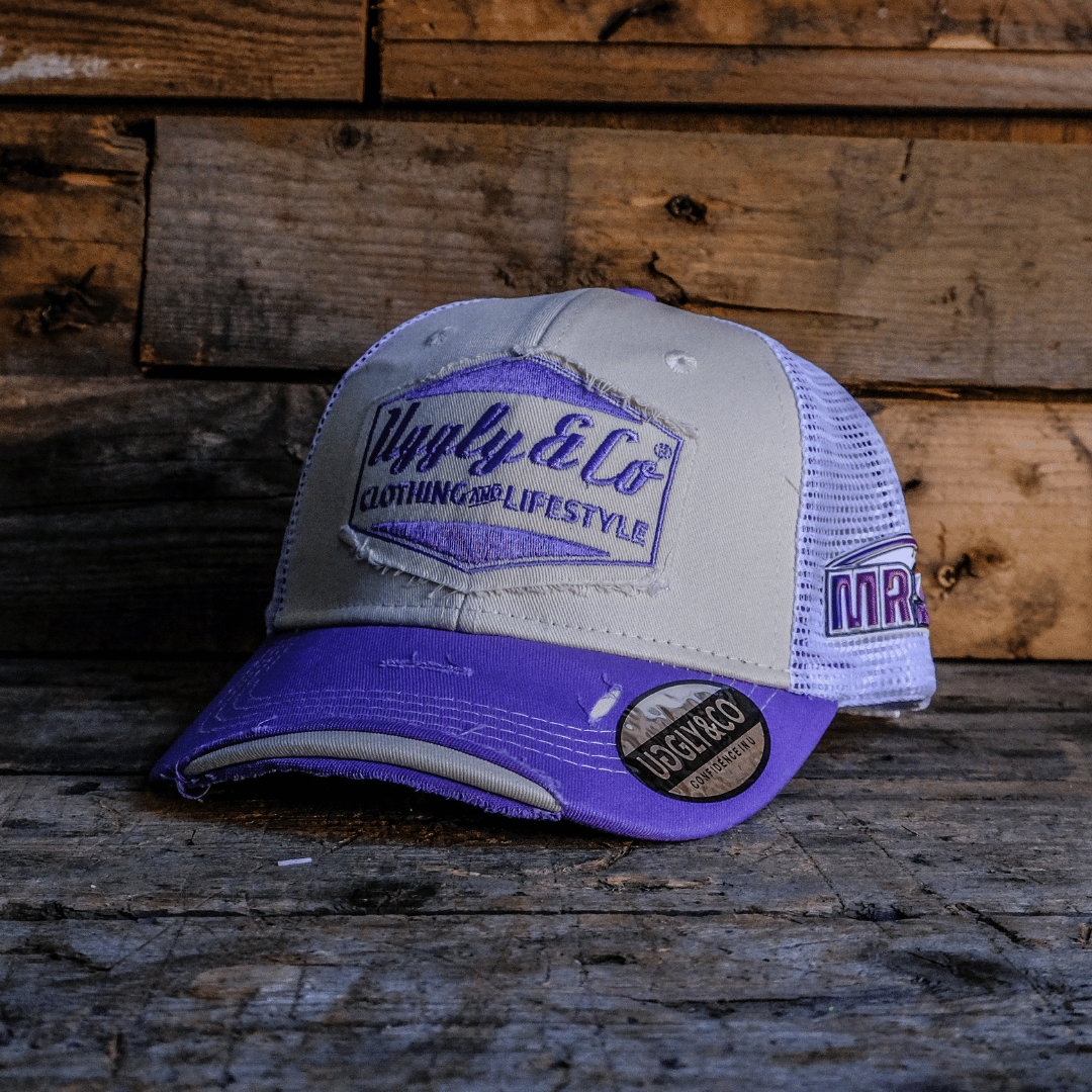 White and purple trucker hat with Uggly&Co diamond logo on the front, a mesh back and Mitch Rees Racing logo on the side